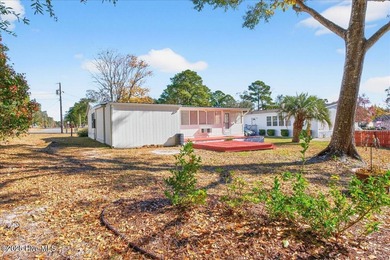 Come home to your beach getaway. This two bedroom, two flex on Oyster Bay Golf Links in North Carolina - for sale on GolfHomes.com, golf home, golf lot