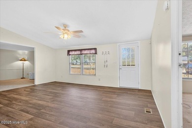 Come home to your beach getaway. This two bedroom, two flex on Oyster Bay Golf Links in North Carolina - for sale on GolfHomes.com, golf home, golf lot