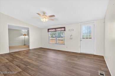 Come home to your beach getaway. This two bedroom, two flex on Oyster Bay Golf Links in North Carolina - for sale on GolfHomes.com, golf home, golf lot