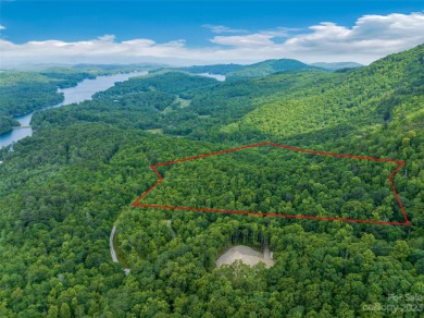 Perfectly located overlooking NCs largest private lake, Toxaway on Lake Toxaway Country Club in North Carolina - for sale on GolfHomes.com, golf home, golf lot