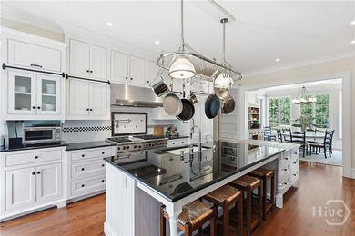 Tucked within this exclusive community, this 4-bed, 4-full & on The Ford Field and River Club  in Georgia - for sale on GolfHomes.com, golf home, golf lot