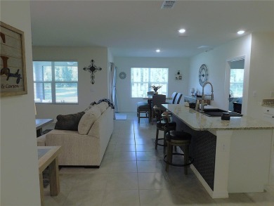 JUST LIKE NEW.. BUT BETTER! This barely lived in Aria model home on Lake Diamond Golf and Country Club in Florida - for sale on GolfHomes.com, golf home, golf lot