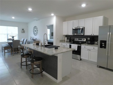 JUST LIKE NEW.. BUT BETTER! This barely lived in Aria model home on Lake Diamond Golf and Country Club in Florida - for sale on GolfHomes.com, golf home, golf lot