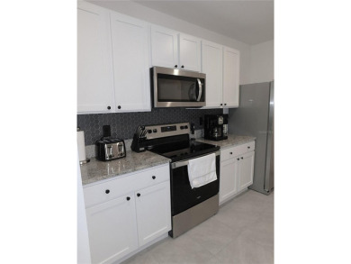 JUST LIKE NEW.. BUT BETTER! This barely lived in Aria model home on Lake Diamond Golf and Country Club in Florida - for sale on GolfHomes.com, golf home, golf lot