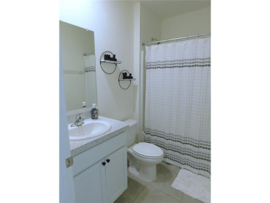 JUST LIKE NEW.. BUT BETTER! This barely lived in Aria model home on Lake Diamond Golf and Country Club in Florida - for sale on GolfHomes.com, golf home, golf lot