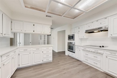 Tucked beneath mature trees in one of Rockwall's most on The Shores Country Club in Texas - for sale on GolfHomes.com, golf home, golf lot