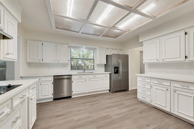 Tucked beneath mature trees in one of Rockwall's most on The Shores Country Club in Texas - for sale on GolfHomes.com, golf home, golf lot