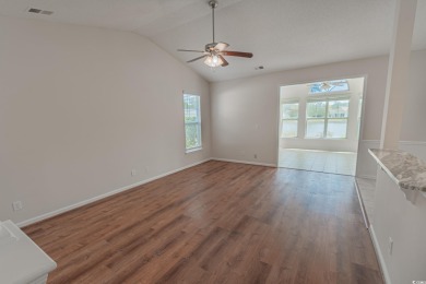 Welcome to 41 Bear Creek Loop! A beautiful lakefront retreat in on TPC of Myrtle Beach in South Carolina - for sale on GolfHomes.com, golf home, golf lot
