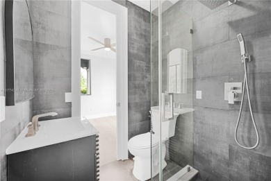 Stunningly renovated 3-bedroom, 3-bathroom home located in the on Normandy Shores Golf Course in Florida - for sale on GolfHomes.com, golf home, golf lot