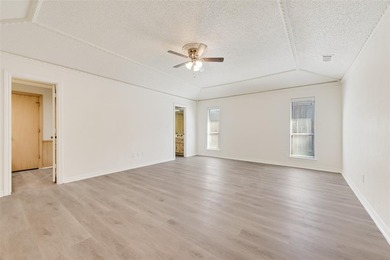 Tucked beneath mature trees in one of Rockwall's most on The Shores Country Club in Texas - for sale on GolfHomes.com, golf home, golf lot