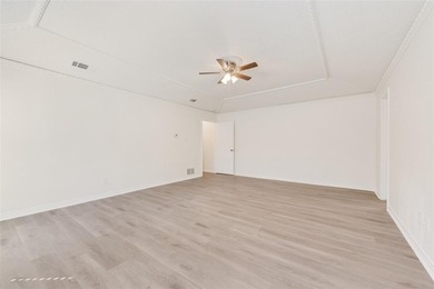 Tucked beneath mature trees in one of Rockwall's most on The Shores Country Club in Texas - for sale on GolfHomes.com, golf home, golf lot