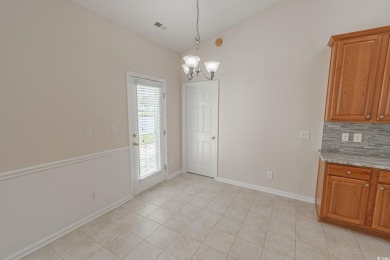 Welcome to 41 Bear Creek Loop! A beautiful lakefront retreat in on TPC of Myrtle Beach in South Carolina - for sale on GolfHomes.com, golf home, golf lot
