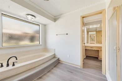 Tucked beneath mature trees in one of Rockwall's most on The Shores Country Club in Texas - for sale on GolfHomes.com, golf home, golf lot