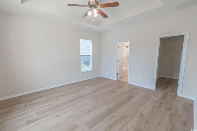 Welcome to 41 Bear Creek Loop! A beautiful lakefront retreat in on TPC of Myrtle Beach in South Carolina - for sale on GolfHomes.com, golf home, golf lot