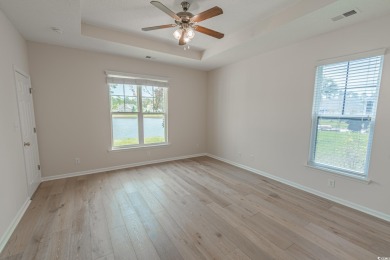 Welcome to 41 Bear Creek Loop! A beautiful lakefront retreat in on TPC of Myrtle Beach in South Carolina - for sale on GolfHomes.com, golf home, golf lot