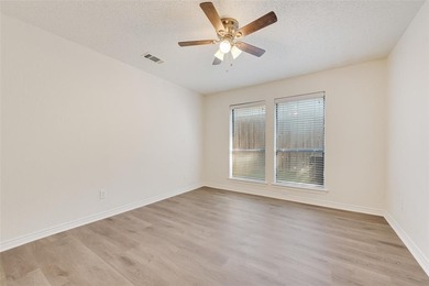 Tucked beneath mature trees in one of Rockwall's most on The Shores Country Club in Texas - for sale on GolfHomes.com, golf home, golf lot