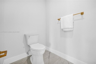 Stunningly renovated 3-bedroom, 3-bathroom home located in the on Normandy Shores Golf Course in Florida - for sale on GolfHomes.com, golf home, golf lot