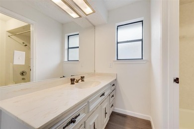 Tucked beneath mature trees in one of Rockwall's most on The Shores Country Club in Texas - for sale on GolfHomes.com, golf home, golf lot