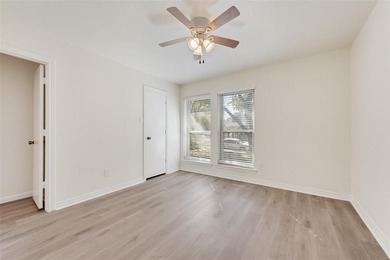 Tucked beneath mature trees in one of Rockwall's most on The Shores Country Club in Texas - for sale on GolfHomes.com, golf home, golf lot