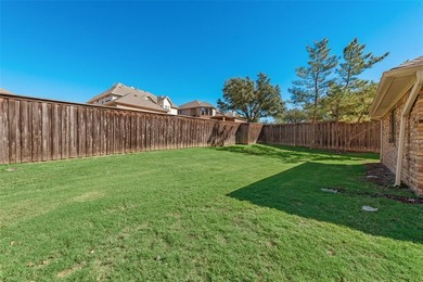 Tucked beneath mature trees in one of Rockwall's most on The Shores Country Club in Texas - for sale on GolfHomes.com, golf home, golf lot