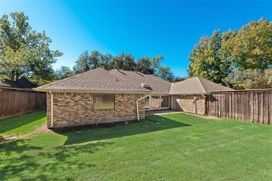 Tucked beneath mature trees in one of Rockwall's most on The Shores Country Club in Texas - for sale on GolfHomes.com, golf home, golf lot