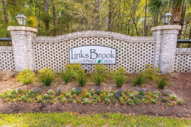 Welcome to 41 Bear Creek Loop! A beautiful lakefront retreat in on TPC of Myrtle Beach in South Carolina - for sale on GolfHomes.com, golf home, golf lot