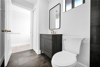 Stunningly renovated 3-bedroom, 3-bathroom home located in the on Normandy Shores Golf Course in Florida - for sale on GolfHomes.com, golf home, golf lot