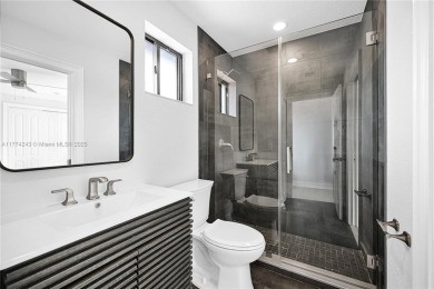 Stunningly renovated 3-bedroom, 3-bathroom home located in the on Normandy Shores Golf Course in Florida - for sale on GolfHomes.com, golf home, golf lot