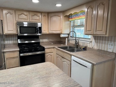 Large lot, waterfront, end unit featuring 2.5 baths, great views on Edgewater Beach Resort in Florida - for sale on GolfHomes.com, golf home, golf lot