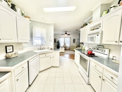 This beautifully renovated residence features 2 bedrooms and 2 on Crane Lakes Golf and Country Club in Florida - for sale on GolfHomes.com, golf home, golf lot