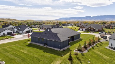 Welcome home to luxury, comfort, and boundless possibilities at on The Powder Horn Golf Club - Mountain in Wyoming - for sale on GolfHomes.com, golf home, golf lot