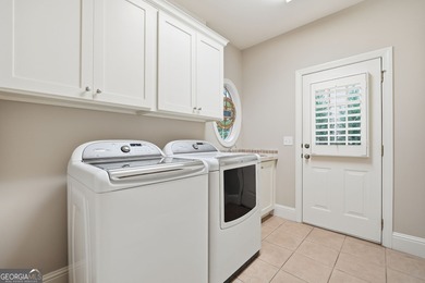 An engaging masterpiece in beautiful Bridgemill Golf & Country on Bridgemill Golf Club in Georgia - for sale on GolfHomes.com, golf home, golf lot