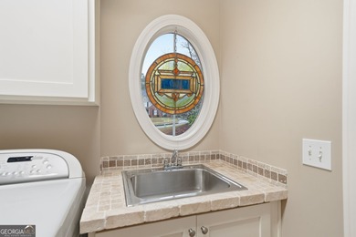 An engaging masterpiece in beautiful Bridgemill Golf & Country on Bridgemill Golf Club in Georgia - for sale on GolfHomes.com, golf home, golf lot