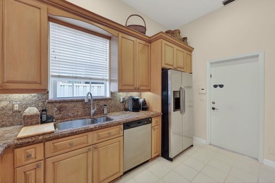 This beautifully maintained 3 bedroom 2 full bathroom home is on Ibis Golf and Country Club in Florida - for sale on GolfHomes.com, golf home, golf lot