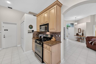 This beautifully maintained 3 bedroom 2 full bathroom home is on Ibis Golf and Country Club in Florida - for sale on GolfHomes.com, golf home, golf lot