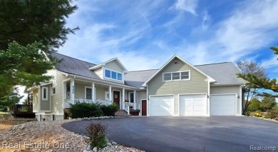 This unique Craftsman-style home offers 1 and a half stories and on Springport Hills Golf Course in Michigan - for sale on GolfHomes.com, golf home, golf lot