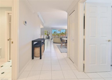 Discover refined coastal living in this rarely available on Club at Pelican Bay Golf Course in Florida - for sale on GolfHomes.com, golf home, golf lot