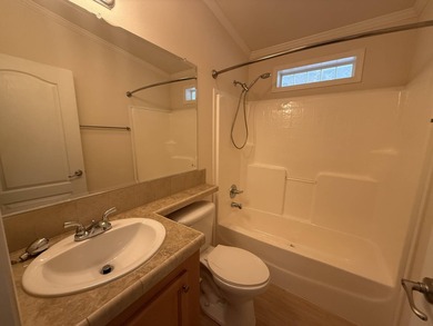 Spacious mobile home in a desirable and active community.  Step on Water Oak Country Club Estates in Florida - for sale on GolfHomes.com, golf home, golf lot