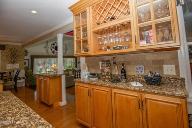 Perfectly positioned on a dog-leg right par five of the Seven on Seven Lakes Country Club in North Carolina - for sale on GolfHomes.com, golf home, golf lot