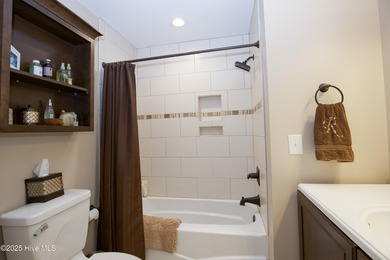 Perfectly positioned on a dog-leg right par five of the Seven on Seven Lakes Country Club in North Carolina - for sale on GolfHomes.com, golf home, golf lot