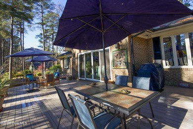 Perfectly positioned on a dog-leg right par five of the Seven on Seven Lakes Country Club in North Carolina - for sale on GolfHomes.com, golf home, golf lot