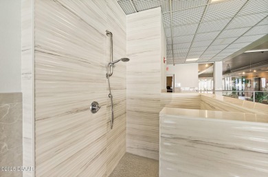 COME HOME TO THIS ELEGANTLY MODERN TAKE ON RELAXED BEACHFRONT on Oceans Golf Club in Florida - for sale on GolfHomes.com, golf home, golf lot