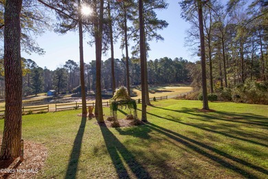 Perfectly positioned on a dog-leg right par five of the Seven on Seven Lakes Country Club in North Carolina - for sale on GolfHomes.com, golf home, golf lot
