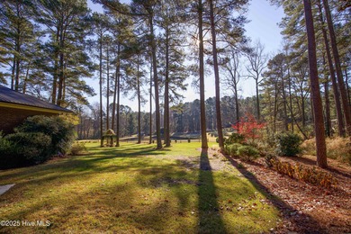 Perfectly positioned on a dog-leg right par five of the Seven on Seven Lakes Country Club in North Carolina - for sale on GolfHomes.com, golf home, golf lot