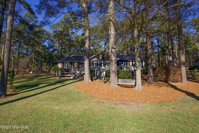 Perfectly positioned on a dog-leg right par five of the Seven on Seven Lakes Country Club in North Carolina - for sale on GolfHomes.com, golf home, golf lot