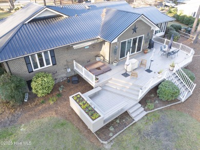 Perfectly positioned on a dog-leg right par five of the Seven on Seven Lakes Country Club in North Carolina - for sale on GolfHomes.com, golf home, golf lot