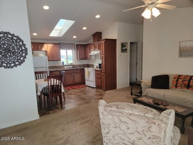 This is a lovely & quaint 2014 3 bedroom 2 bath furnished home on 3 Parks Fairways in Arizona - for sale on GolfHomes.com, golf home, golf lot
