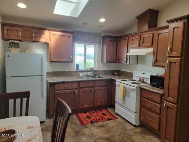 This is a lovely & quaint 2014 3 bedroom 2 bath furnished home on 3 Parks Fairways in Arizona - for sale on GolfHomes.com, golf home, golf lot