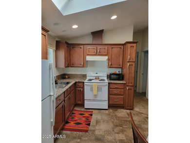 This is a lovely & quaint 2014 3 bedroom 2 bath furnished home on 3 Parks Fairways in Arizona - for sale on GolfHomes.com, golf home, golf lot