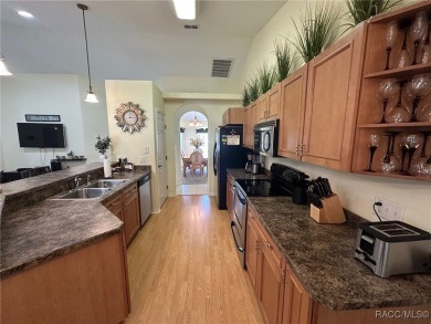 This beautiful custom home features three bedrooms and a on Citrus Springs Country Club in Florida - for sale on GolfHomes.com, golf home, golf lot